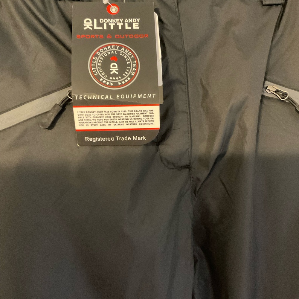 Black rain pants. Fully seemed